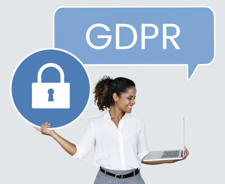 Woman holding laptop with GDPR text - small business data protection